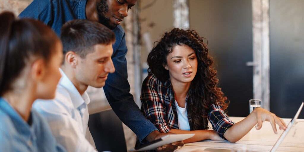 Image depicts a group of people discussing the landscape of saas purchasing.